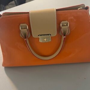 NWOT Arcadia Orange handbag. Never worn! Patent leather. 15” long, 10” high.